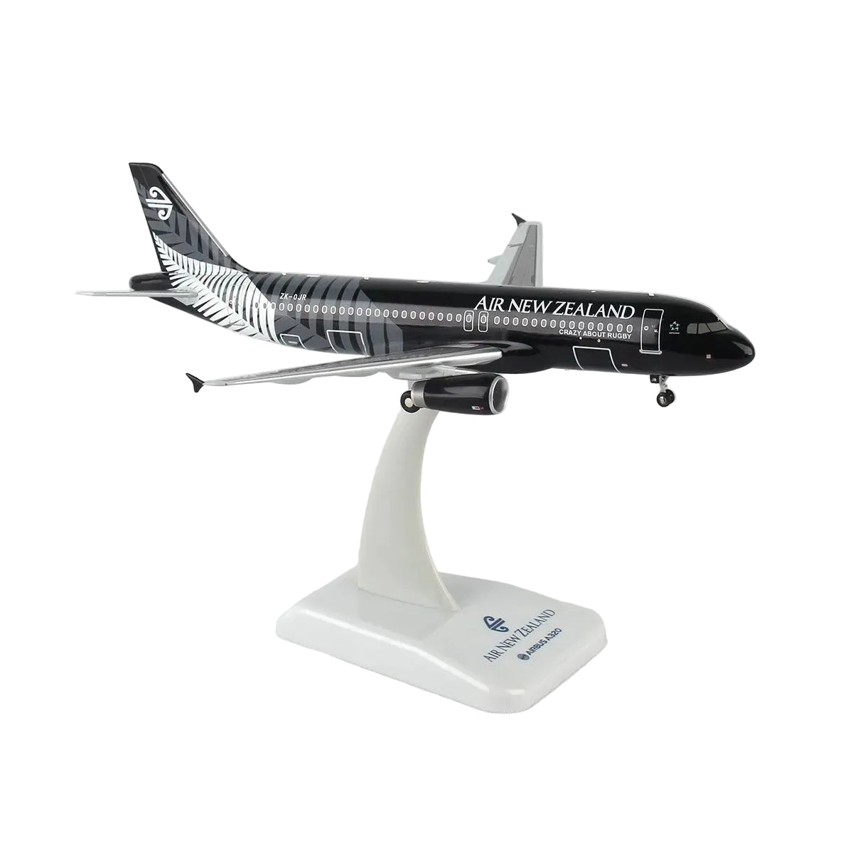 A scale model of an Air New Zealand Airbus A320neo on a white display stand, featuring the airline's black and silver livery.
