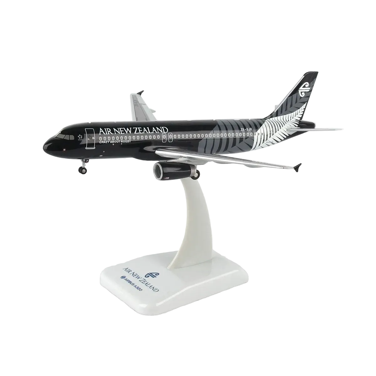 A scale model of an Air New Zealand Airbus A320neo on a white display stand, featuring the airline's black and silver livery.