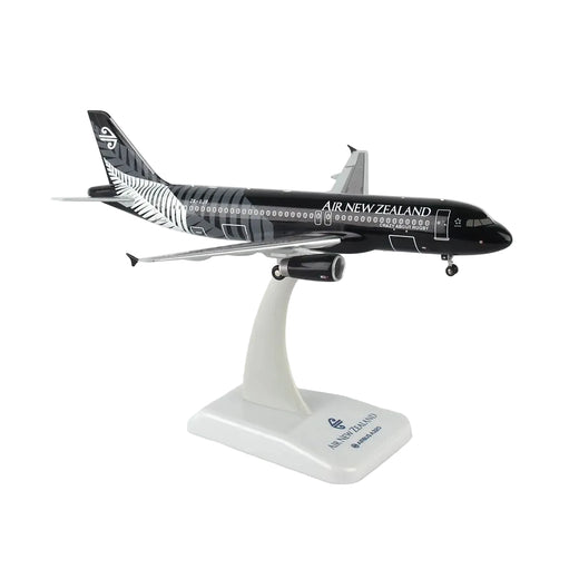 A scale model of an Air New Zealand Airbus A320neo on a white display stand, featuring the airline's black and silver livery.