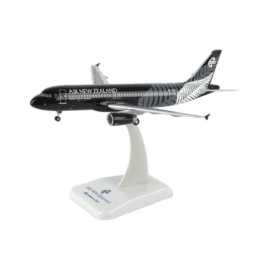 A scale model of an Air New Zealand Airbus A320neo on a white display stand, featuring the airline's black and silver livery.