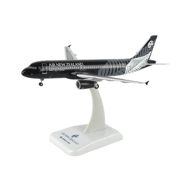 A scale model of an Air New Zealand Airbus A320neo on a white display stand, featuring the airline's black and silver livery.