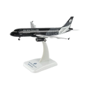 A scale model of an Air New Zealand Airbus A320neo on a white display stand, featuring the airline's black and silver livery.