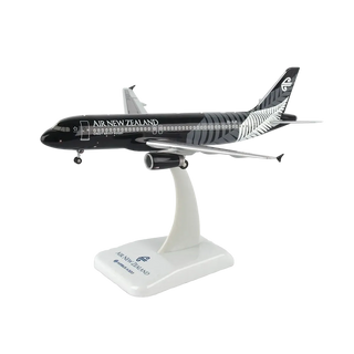 A scale model of an Air New Zealand Airbus A320neo on a white display stand, featuring the airline's black and silver livery.